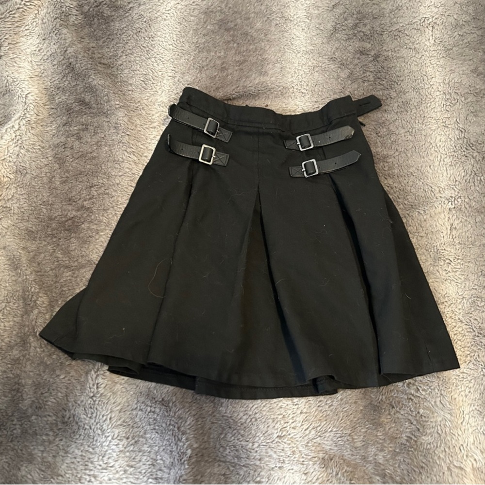 Small hot topic skirt with buckles on the side.